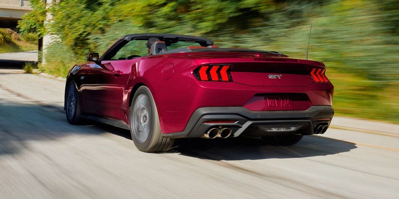 2026 Red Ford Mustang Cruising on Road